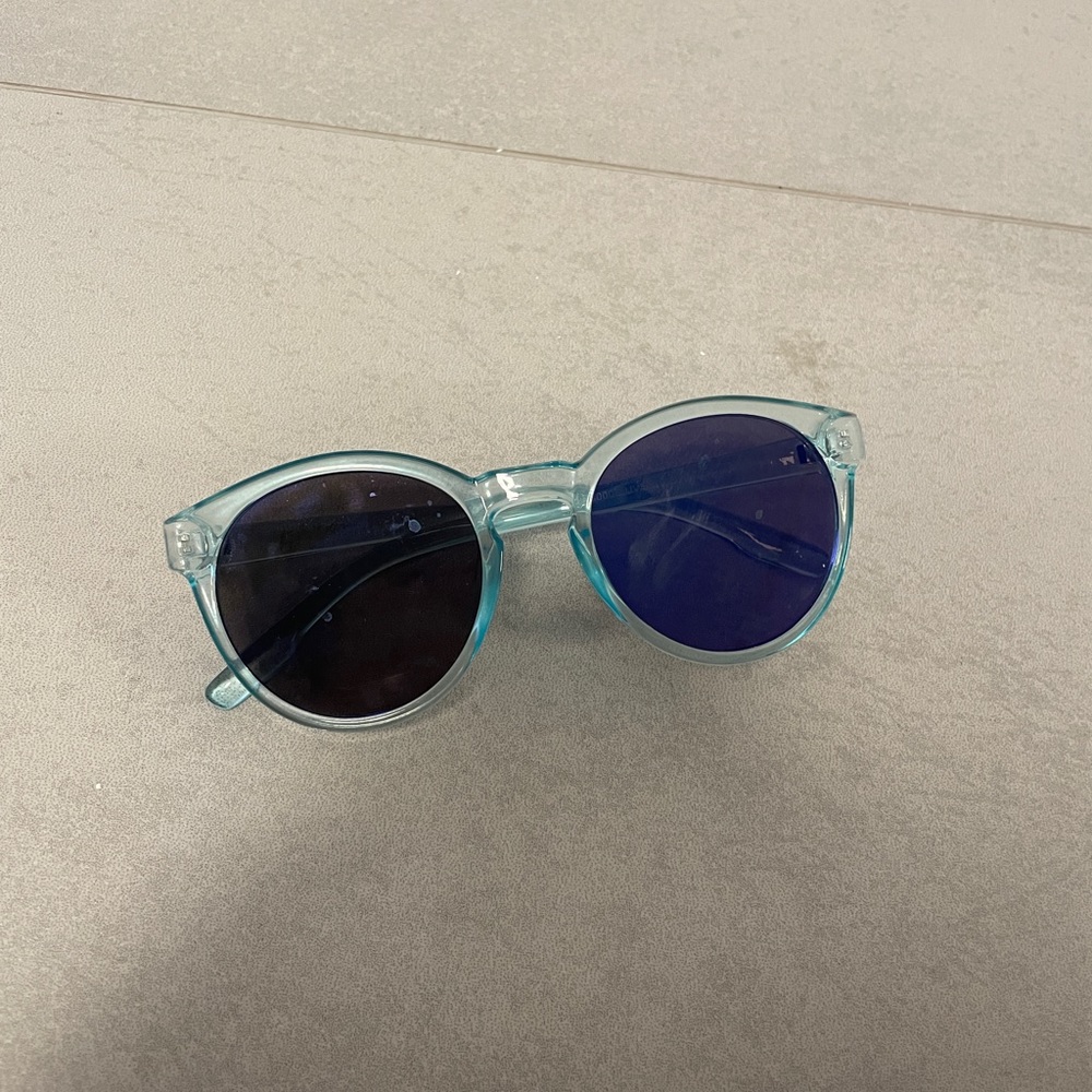 children’s sunglasses in light blue and purple lens